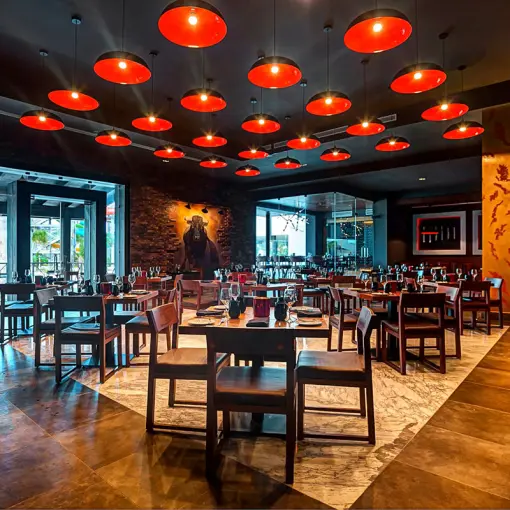 Steakhouse dining room with red pendant lights at Royalton Blue Waters, Montego Bay