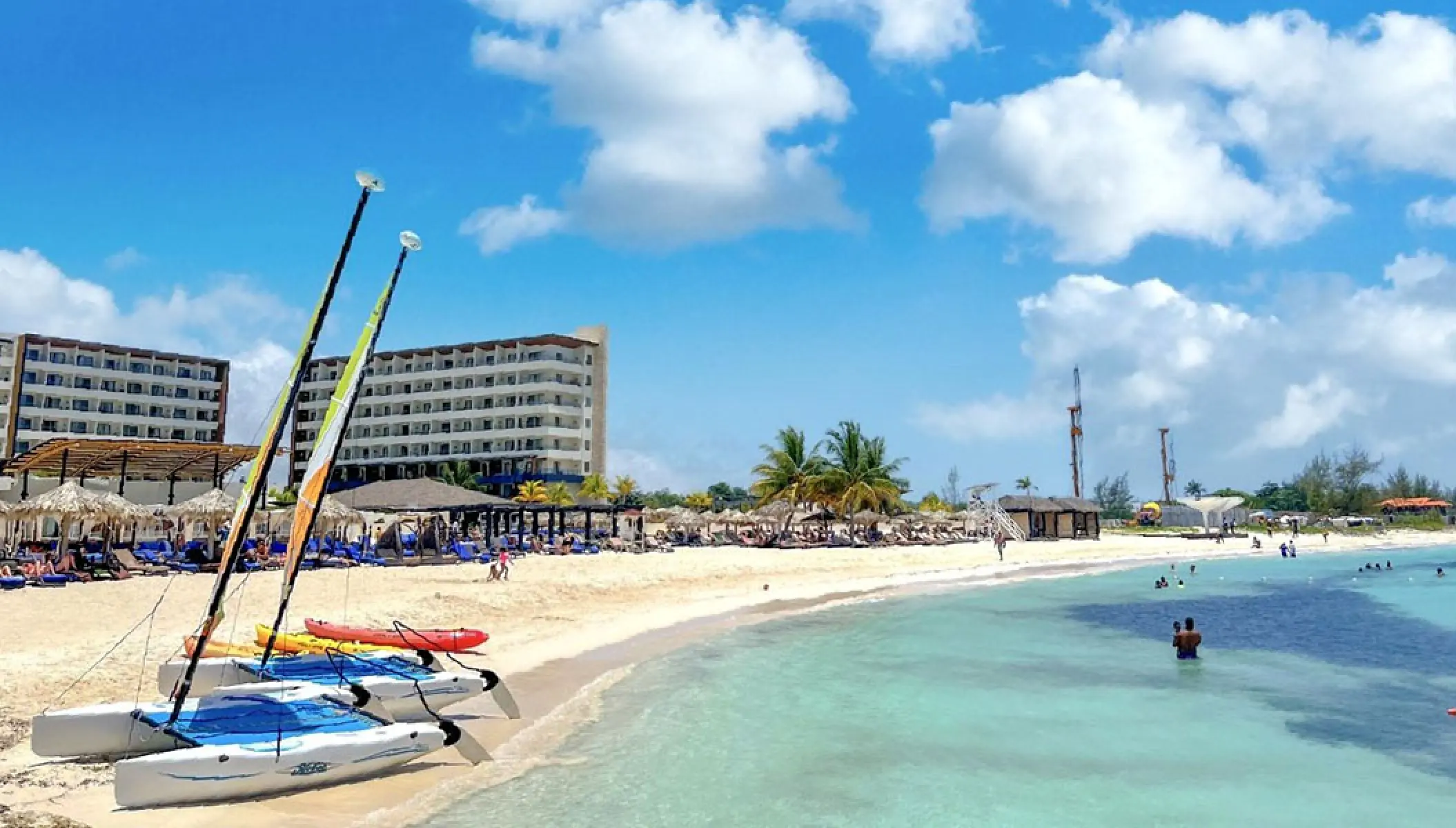 Catamarans on the white sand beach at Royalton Blue Waters, Montego Bay