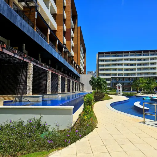 Royalton Blue Waters modern building exterior and lazy river pool, Montego Bay