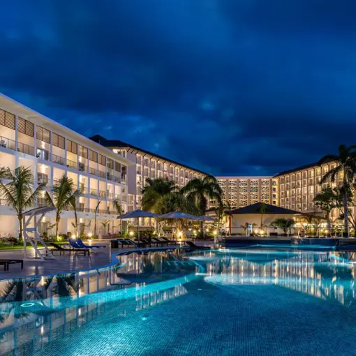 Royalton Blue Waters main pool and buildings at night, Montego Bay
