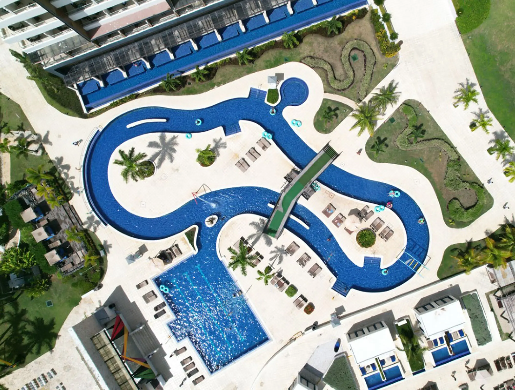 Aerial view of the winding lazy river and swimming pools at Royalton Blue Waters, Montego Bay