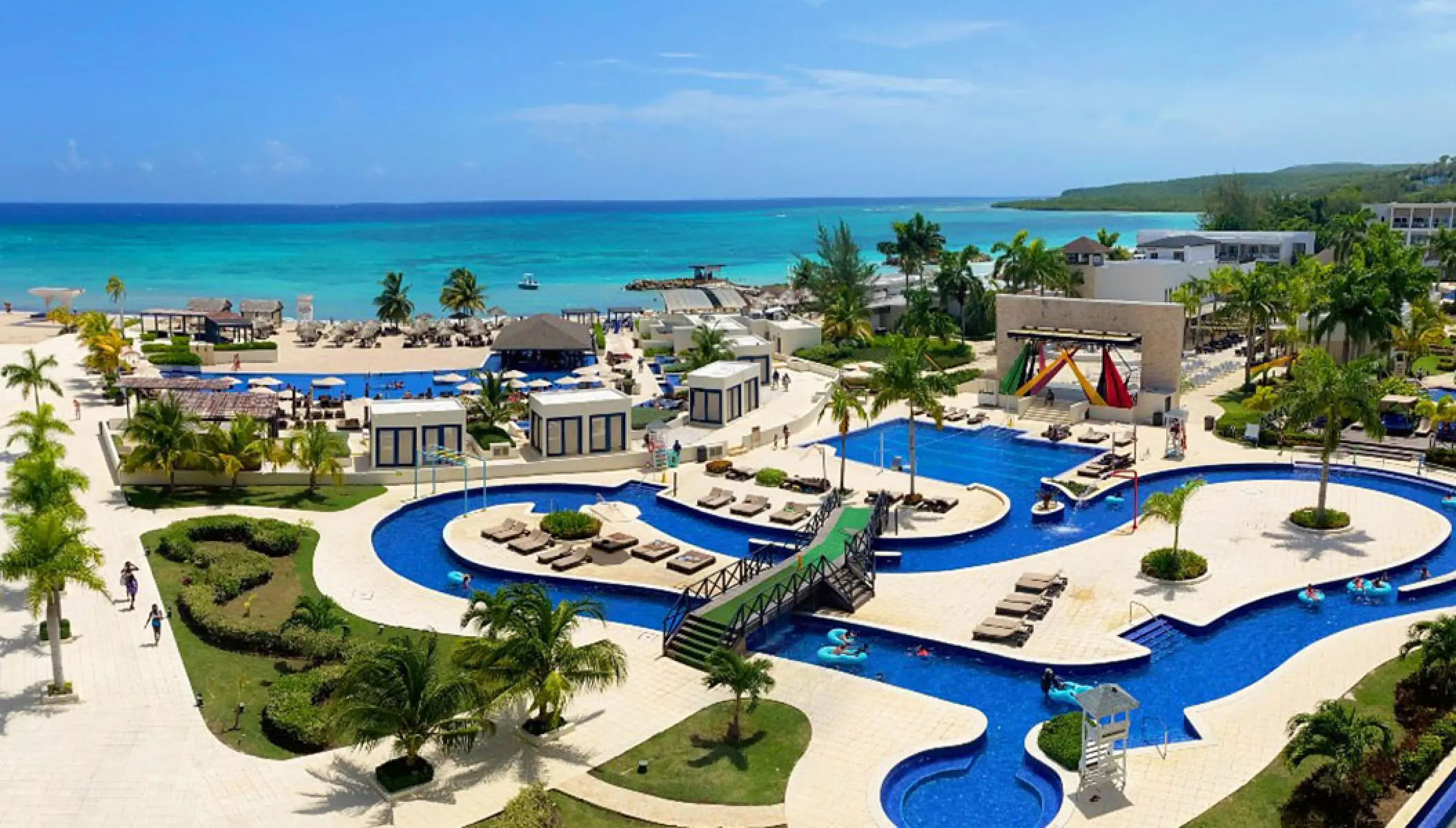 Royalton Blue Waters aerial view of swimming pools and lazy river by the ocean, Montego Bay