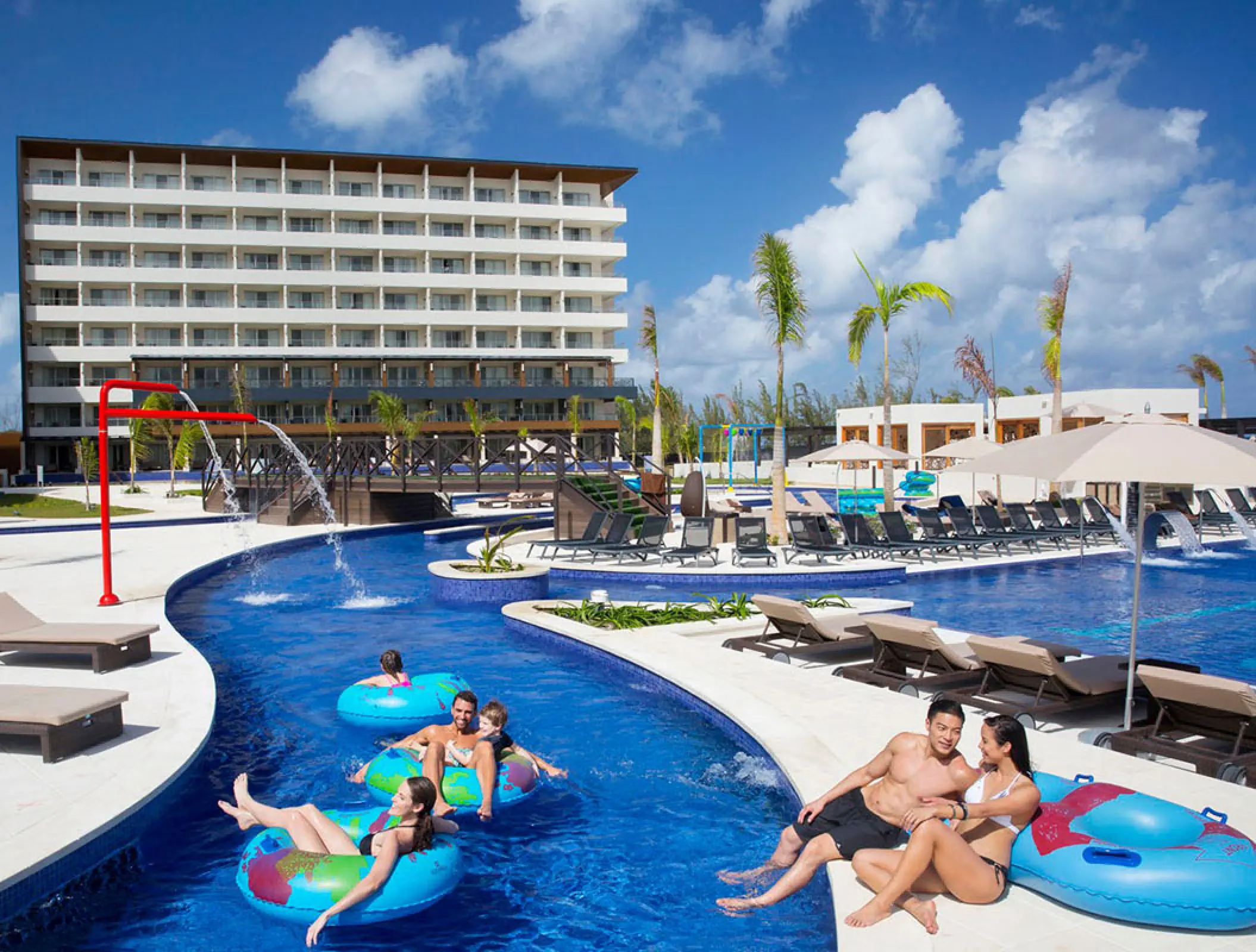 Family activities in the lazy river and main pool area at Royalton Blue Waters, Montego Bay