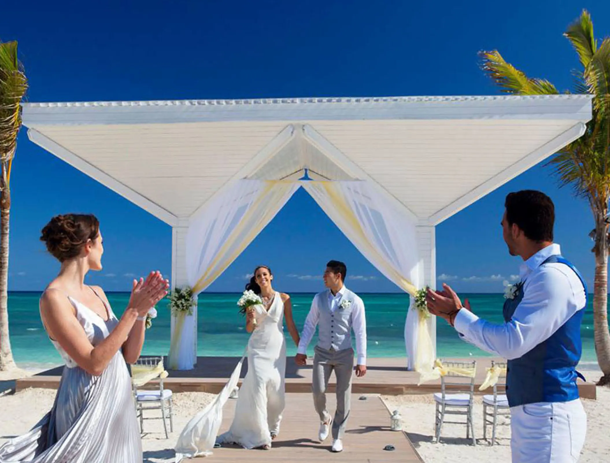 The bride and groom walking down the aisle at Royalton Blue Waters, Montego Bay