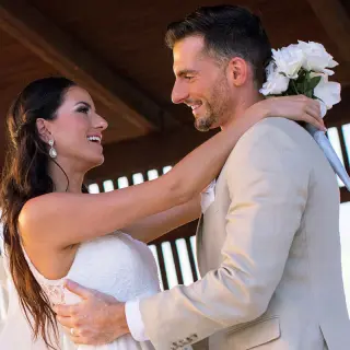 Bride and groom smiling during their intimate wedding ceremony at Royalton Blue Waters, Montego Bay