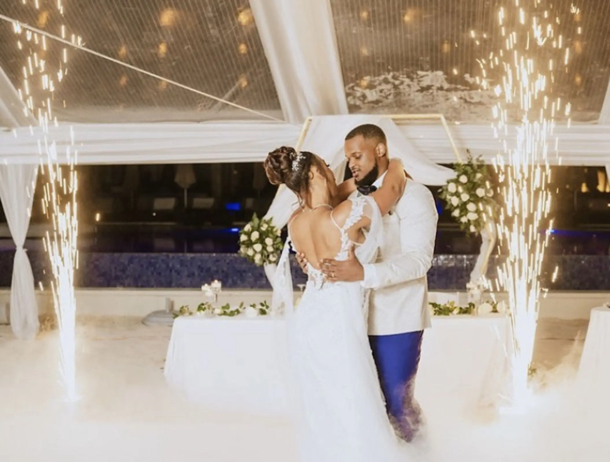 Bride and groom dancing surrounded by spark fountains at Royalton Blue Waters, Montego Bay