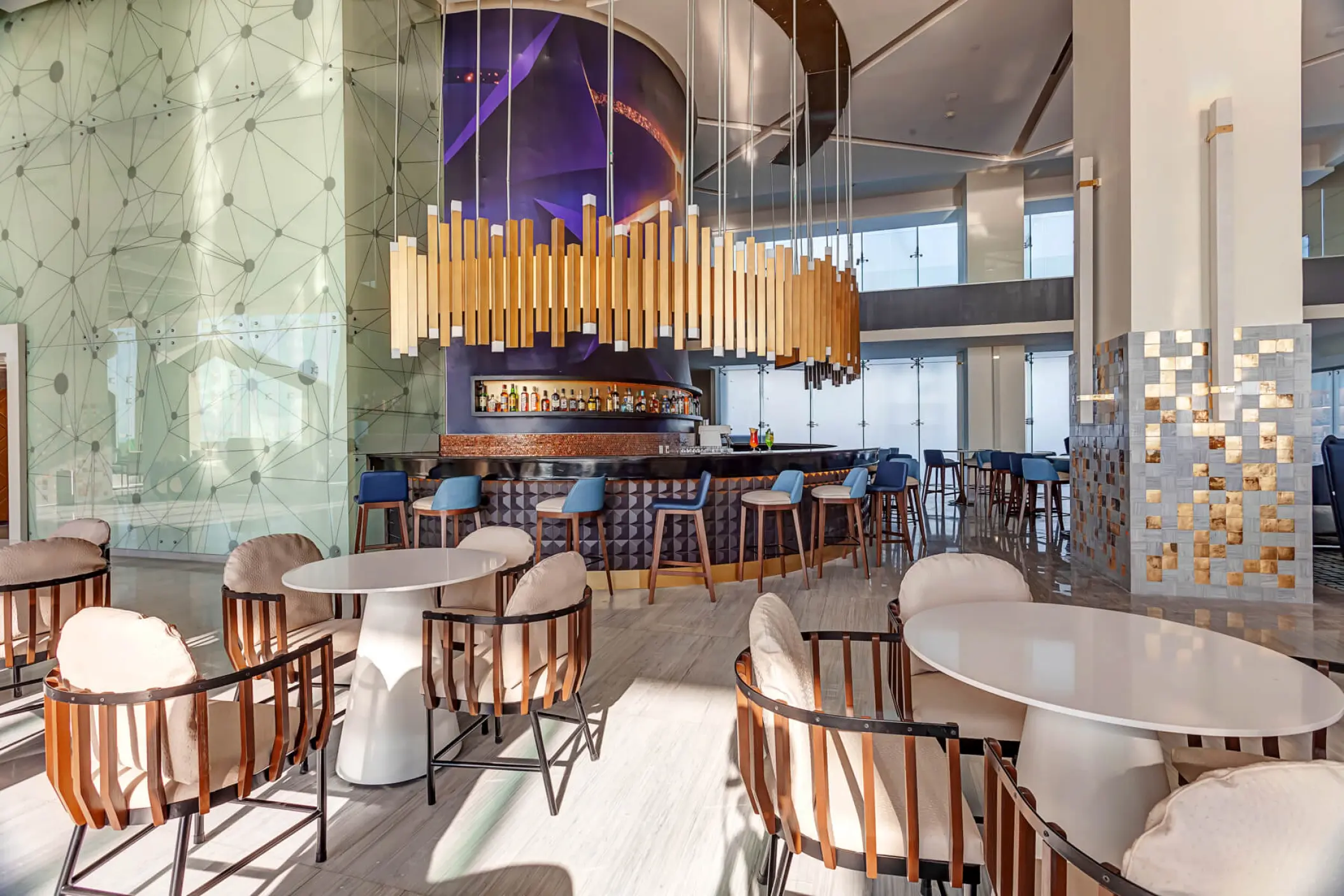Royalton CHIC Cancun modern bar and lounge area with gold pendant lighting, Cancun