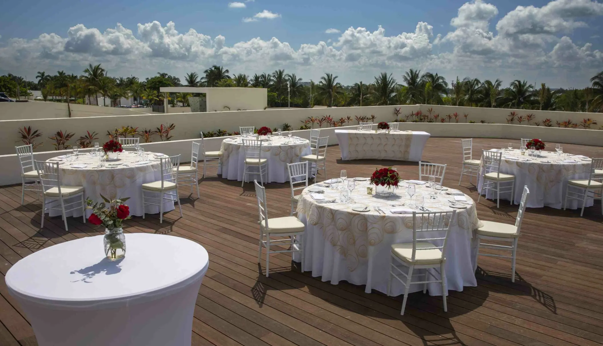 Outdoor wedding reception setup on the Sunset Terrace at Royalton CHIC Cancun