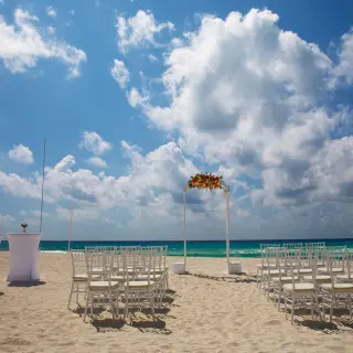Beachfront wedding ceremony setup at Royalton CHIC Cancun