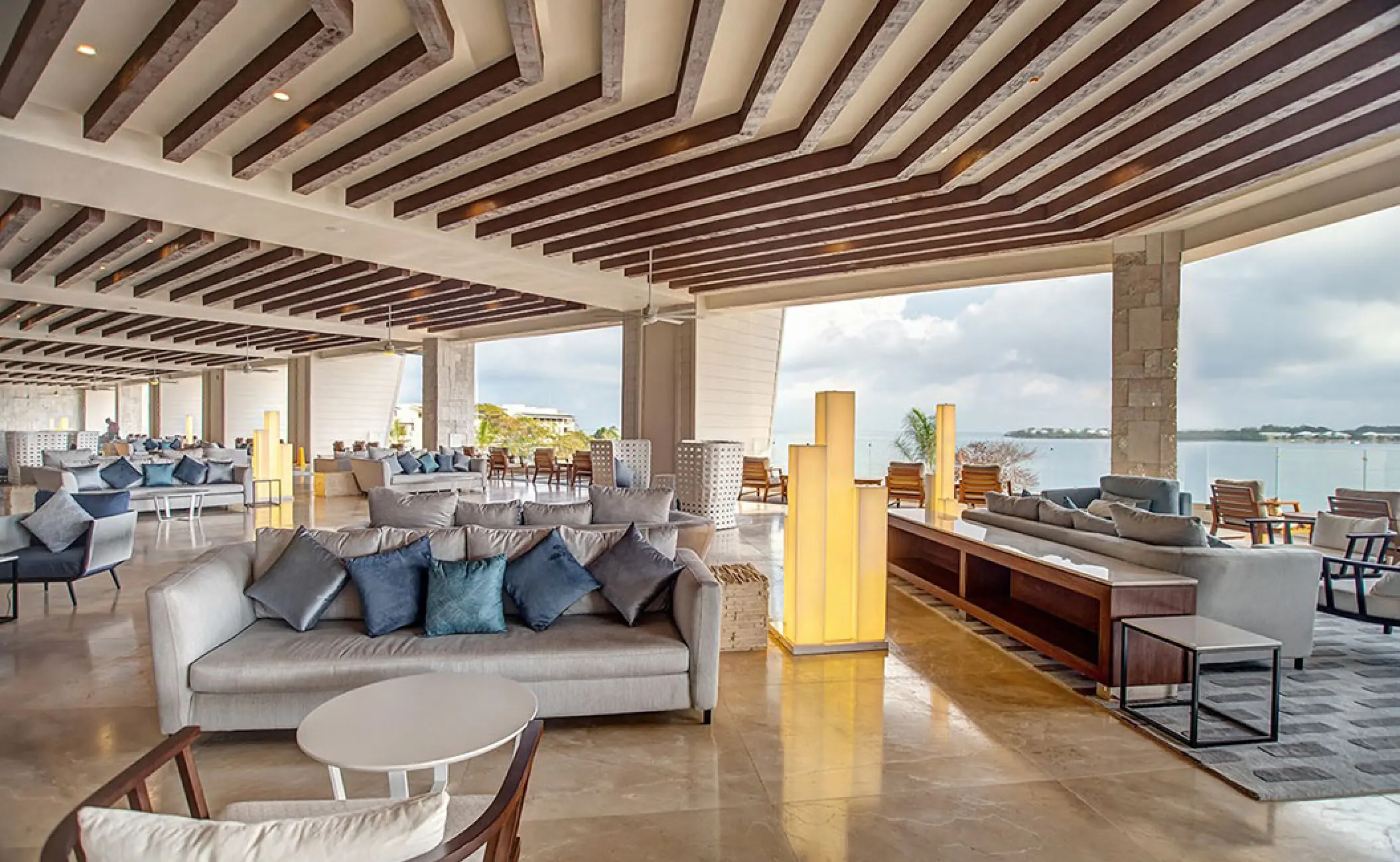 Royalton Negril open-air lounge with plush sofas and ocean views, Negril