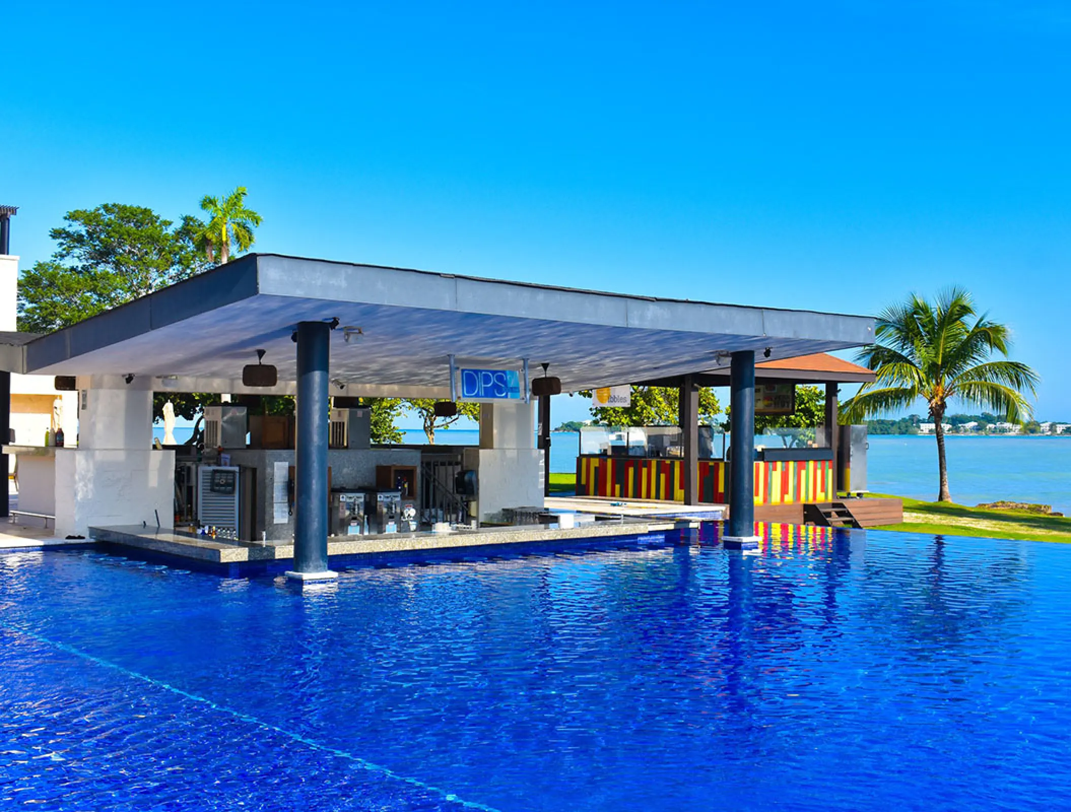 Dips swim-up pool bar overlooking the ocean at Royalton Negril, Negril