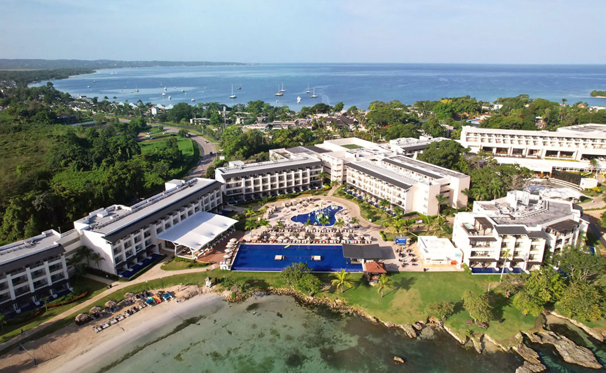 Aerial view of Royalton Negril buildings and pools along the coast, Negril