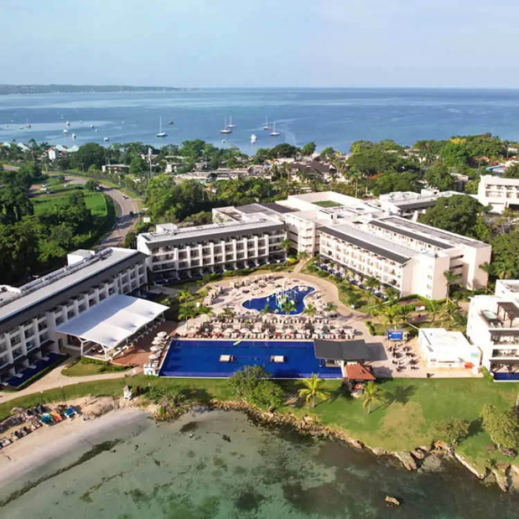 Aerial view of Royalton Negril buildings and pools along the coast, Negril