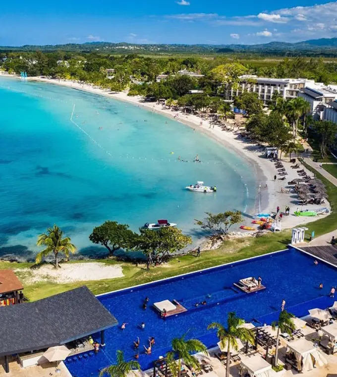Aerial view of Royalton Negril showing the beachfront, pool, and turquoise bay, Negril