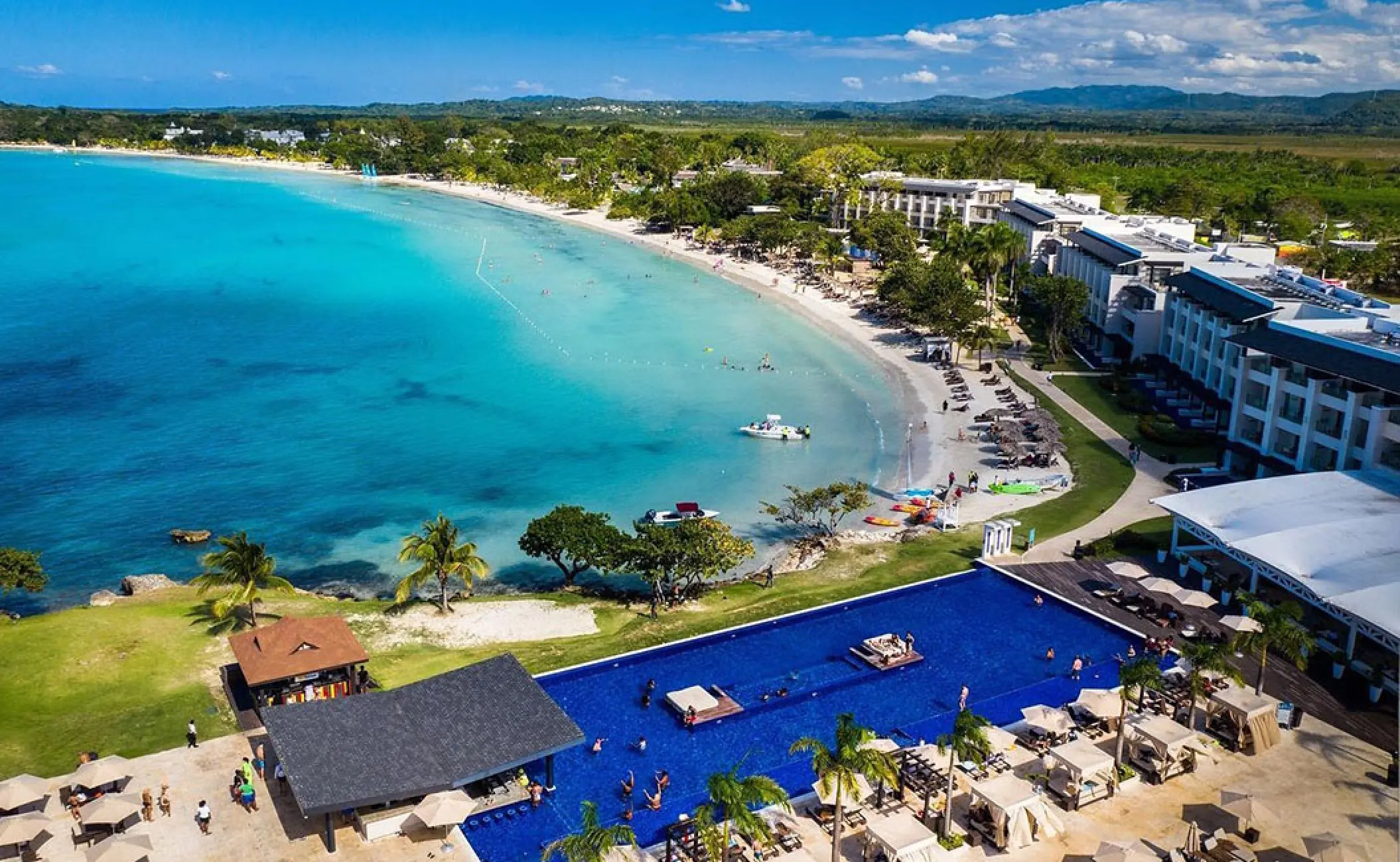 Aerial view of Royalton Negril showing the beachfront, pool, and turquoise bay, Negril