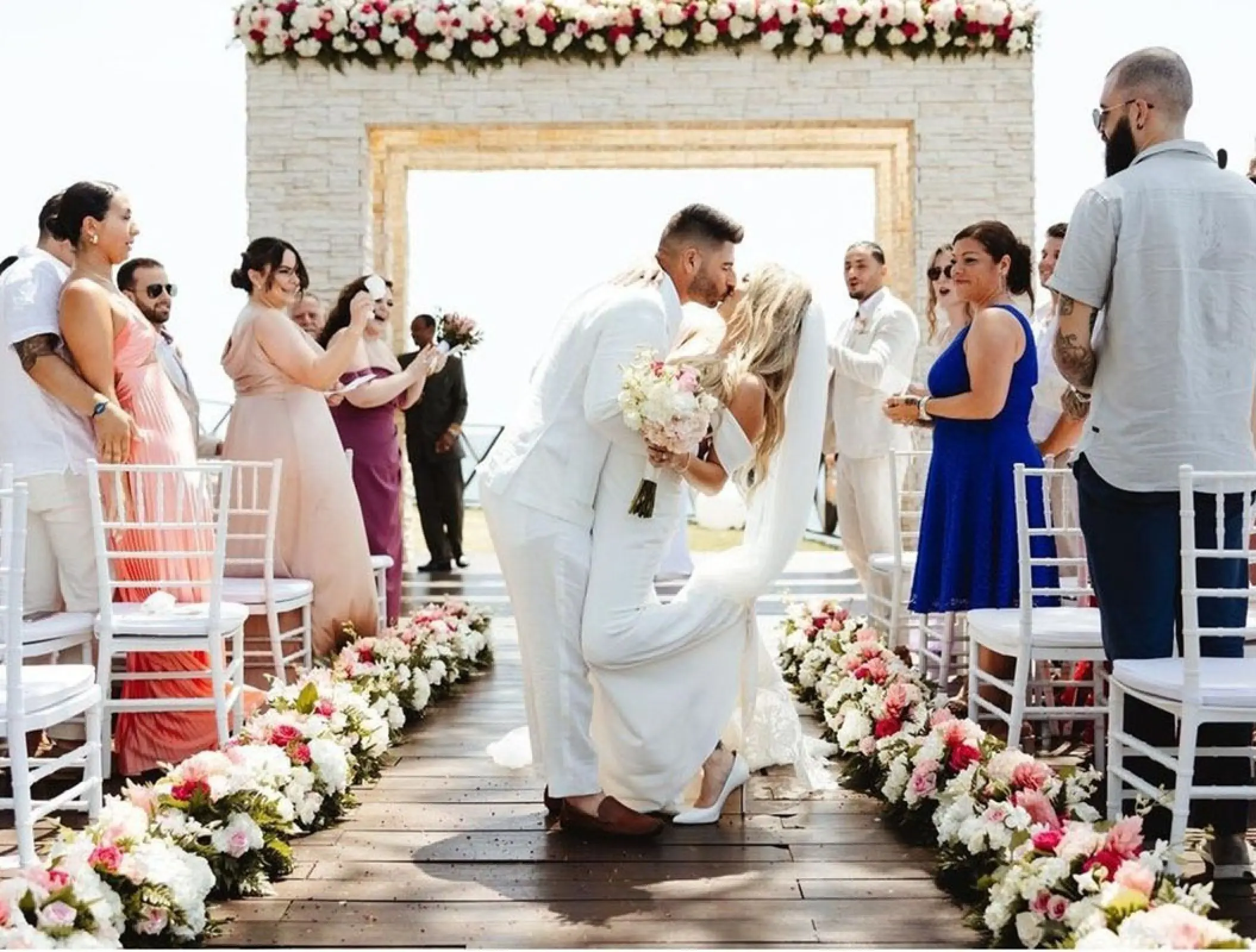 The bride and groom's first kiss during a wedding ceremony at Royalton Negril