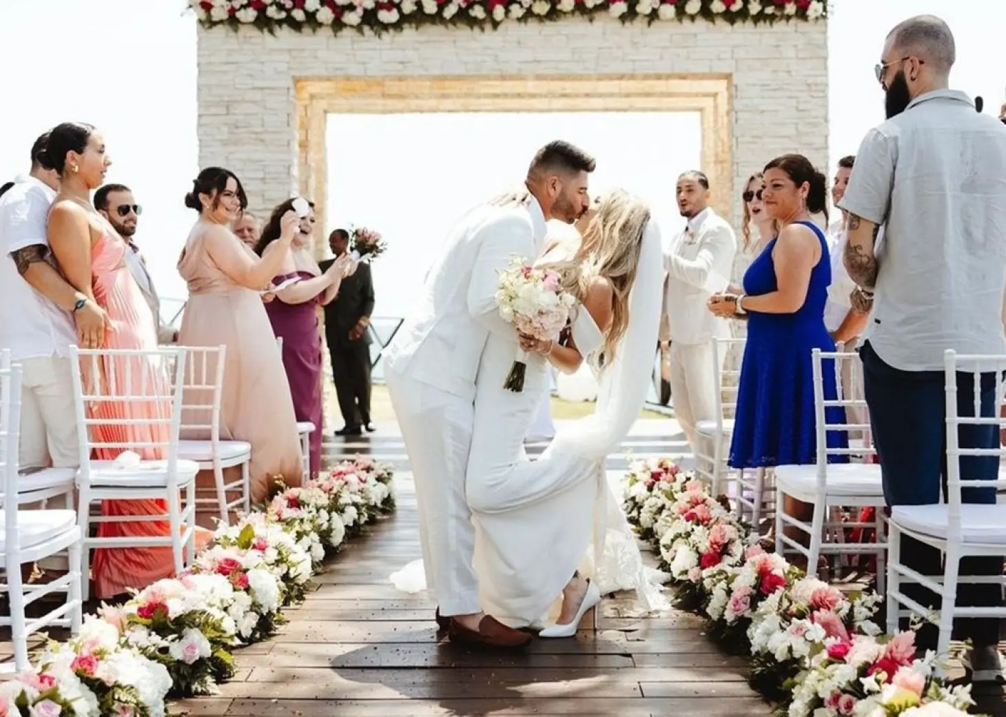 The bride and groom's first kiss during a wedding ceremony at Royalton Negril