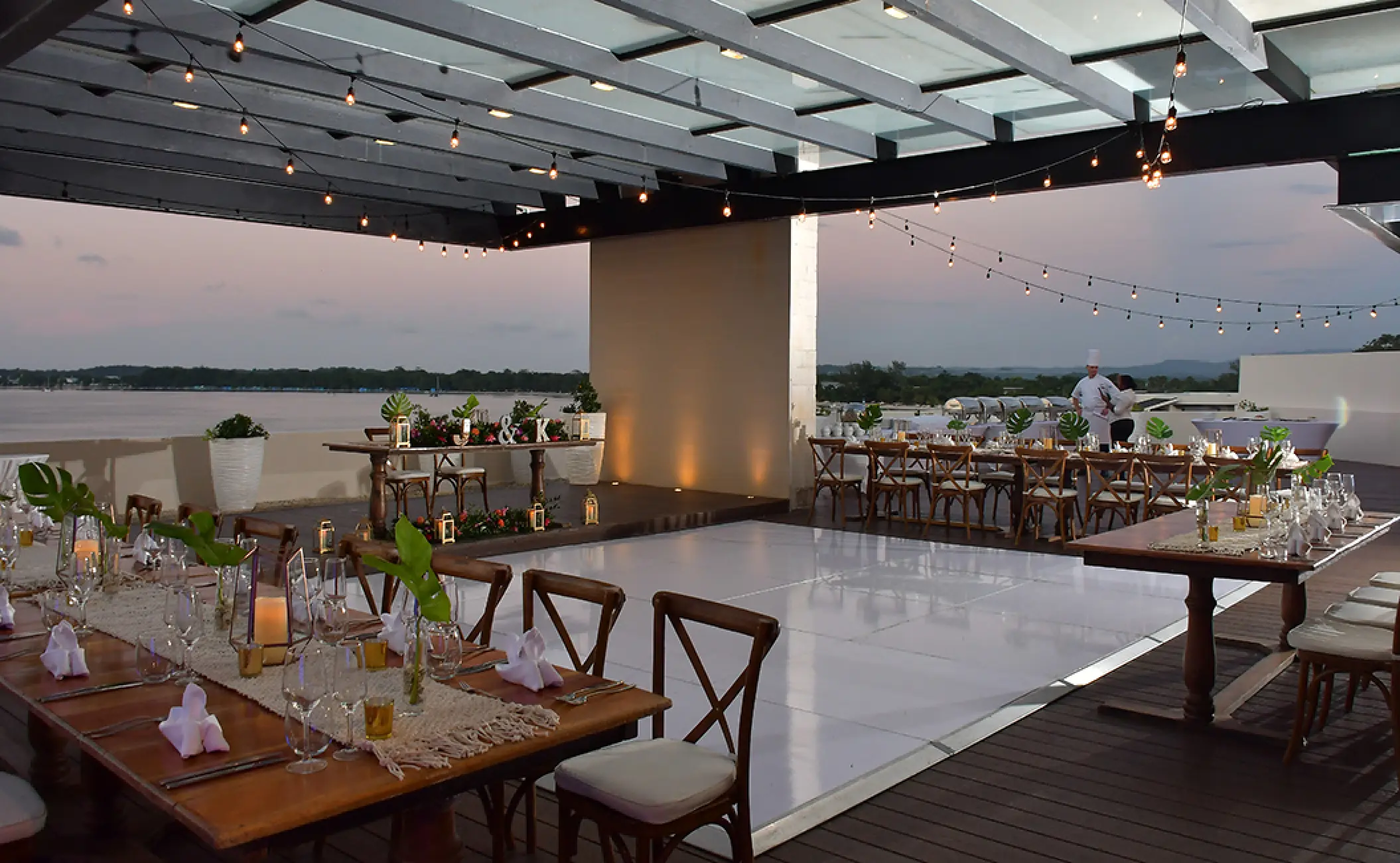 Wedding reception setup with white dance floor on the Sky Terrace at Royalton Negril, Negril