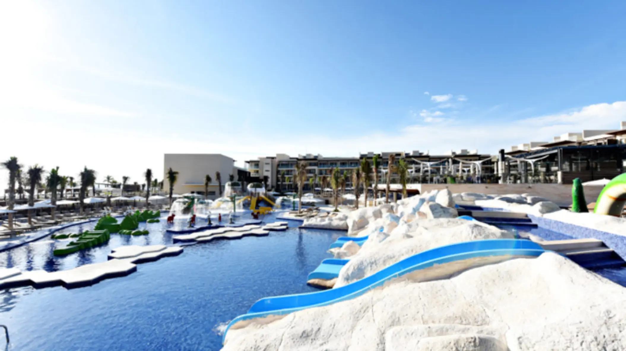 Kids water park with blue slides and splash pads at Royalton Riviera Cancun, Cancun