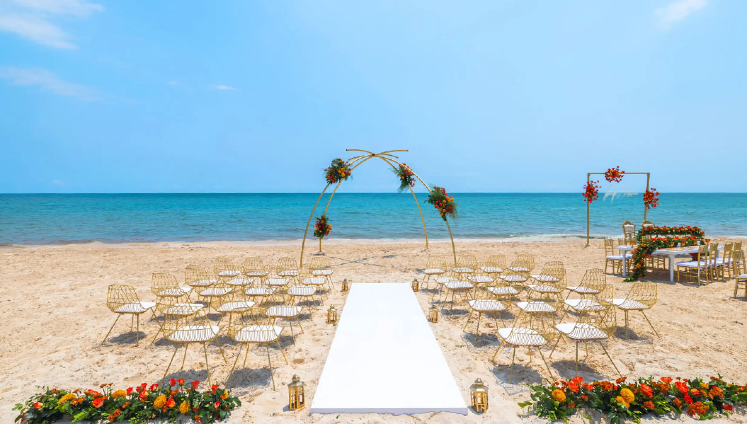 Wedding Ceremony and reception setup at beach venue on Royalton Splash Riviera Cancun