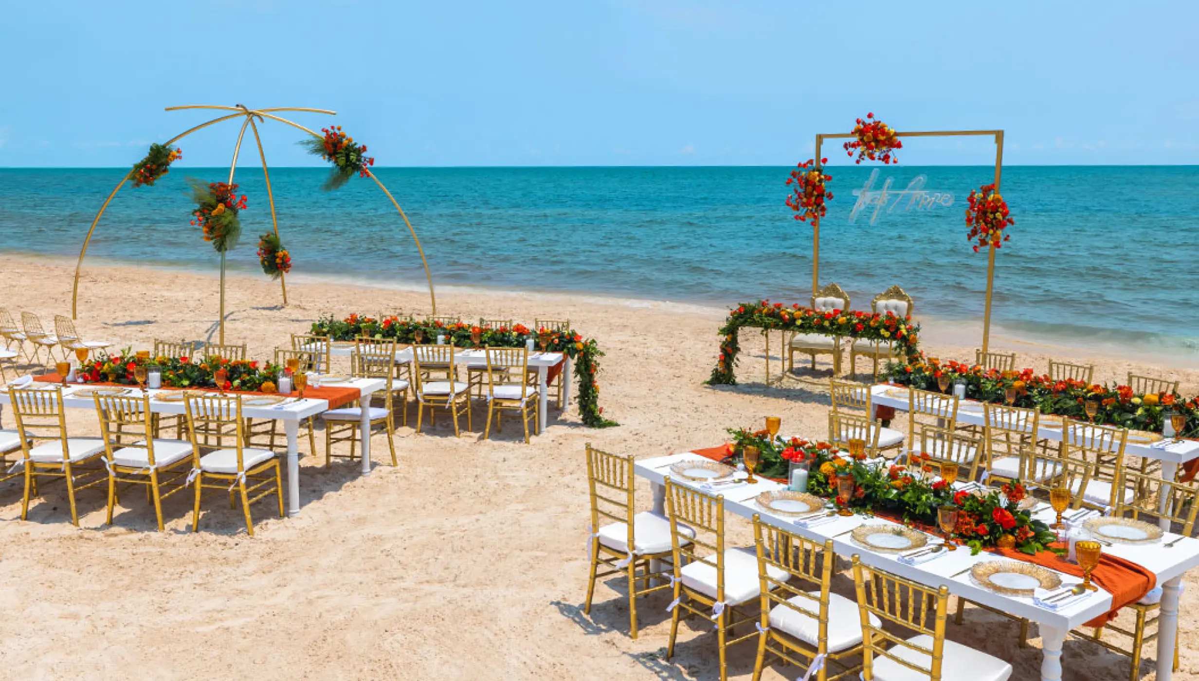 Wedding Ceremony and reception setup at beach venue on Royalton Splash Riviera Cancun