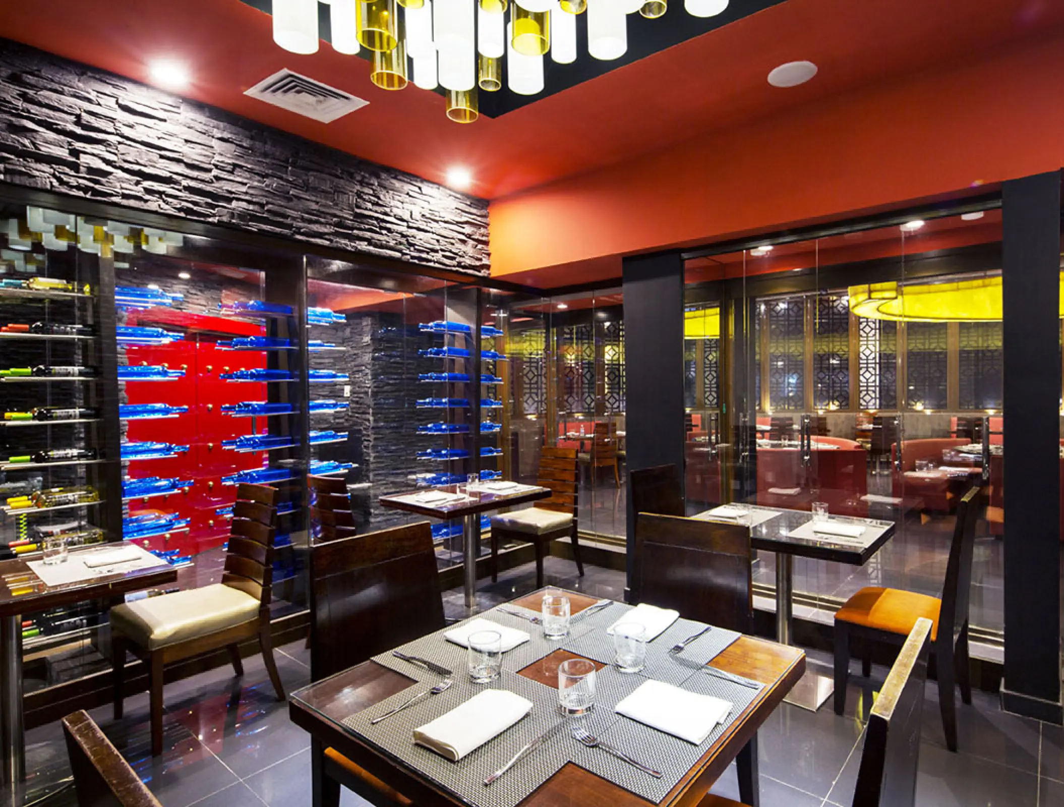 Modern restaurant dining room with wine displays at Royalton Blue Waters, Montego Bay