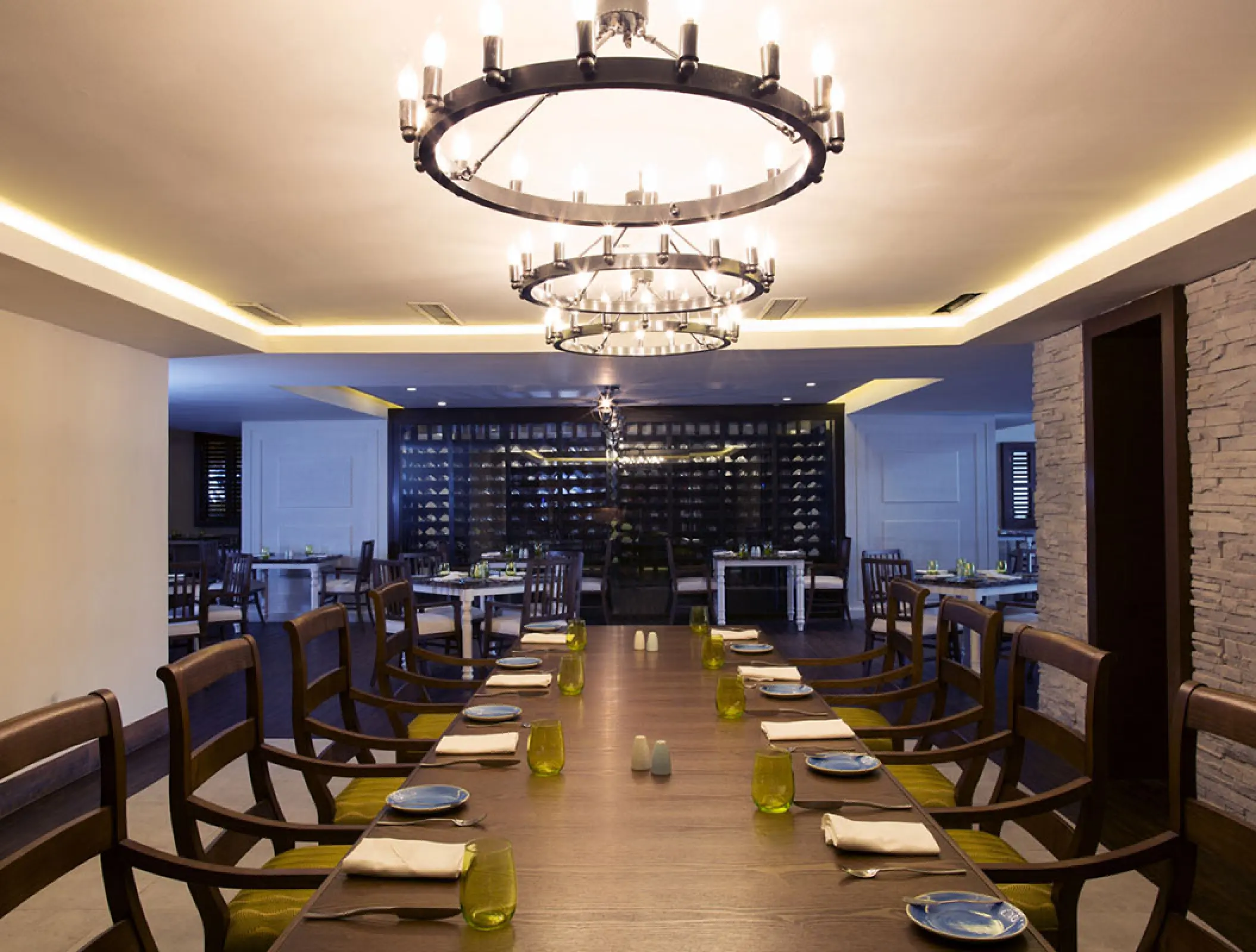 Elegant indoor dining table with chandeliers at Royalton Blue Waters, Montego Bay
