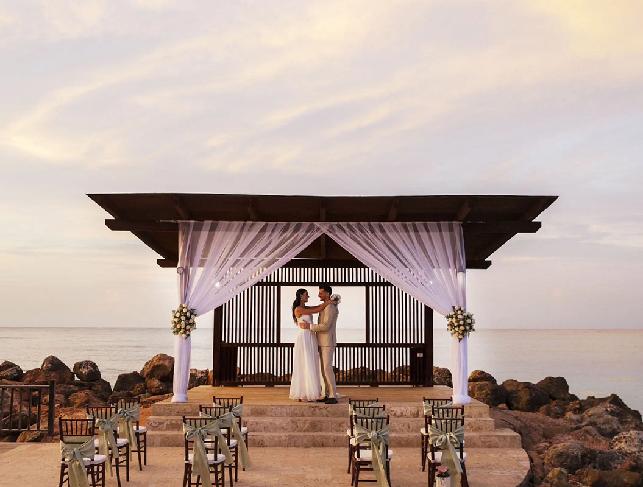 Bride and groom at a beach gazebo wedding ceremony at Royalton Blue Waters, Montego Bay