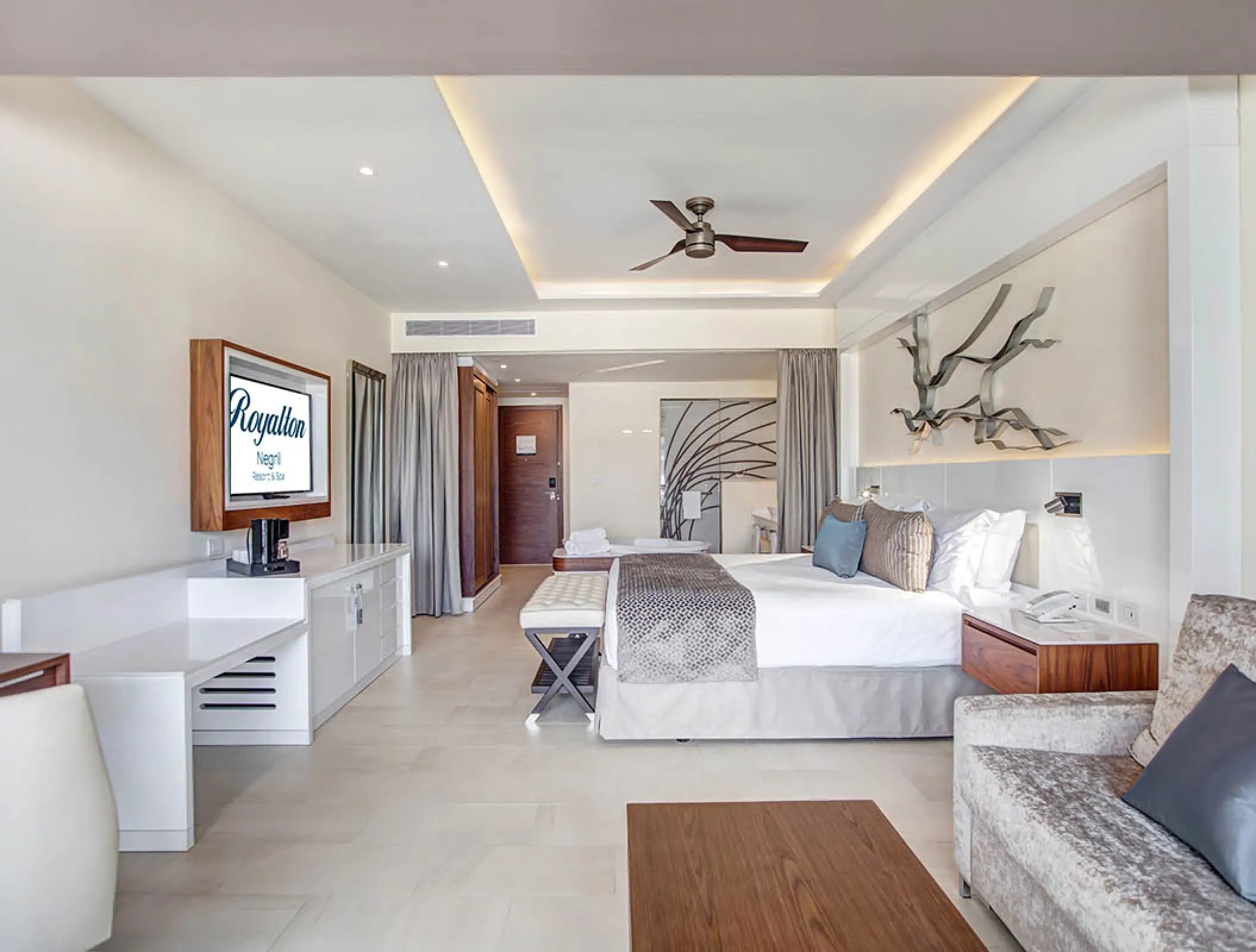 Luxury Junior Suite with king bed and contemporary decor at Royalton Negril, Jamaica