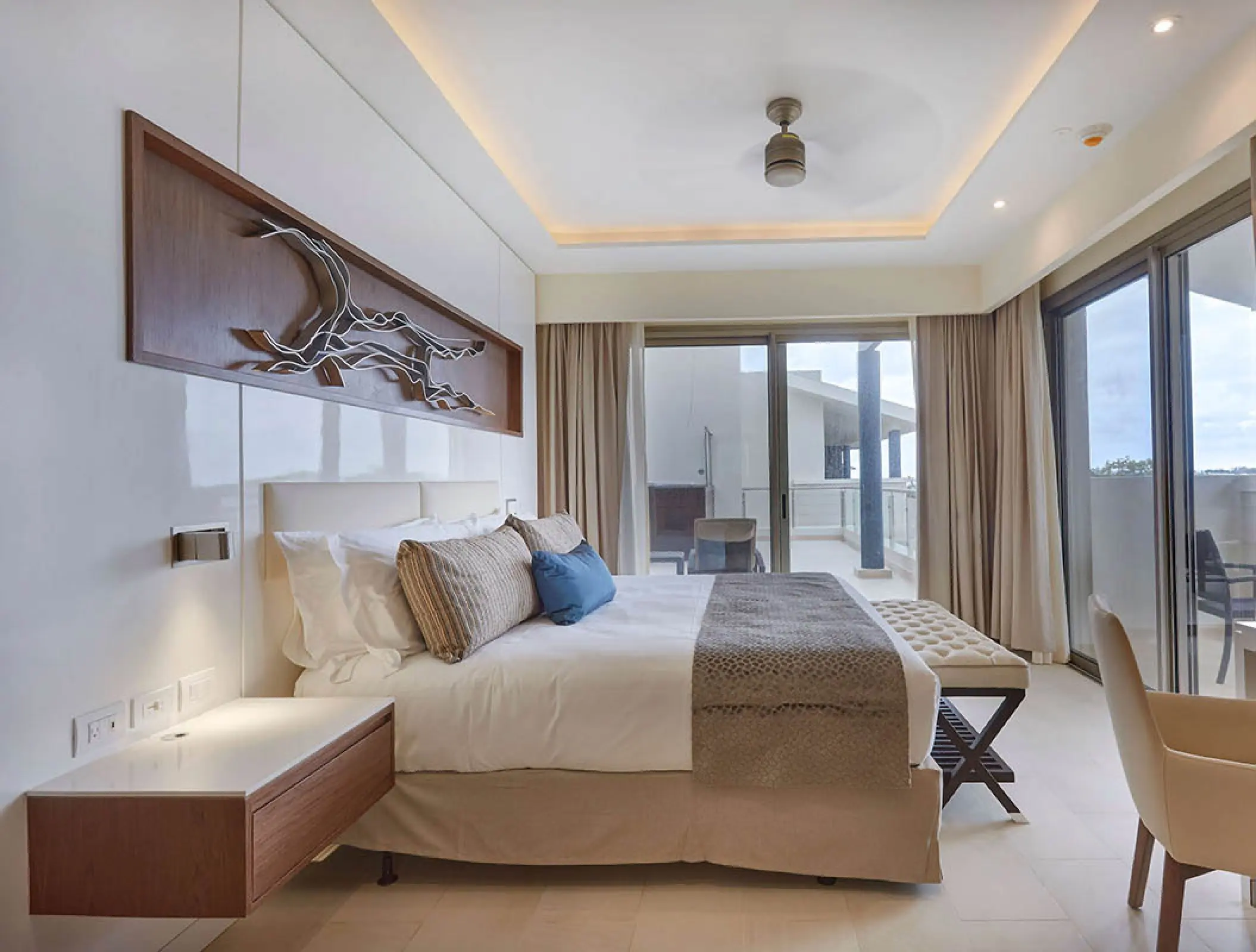 Luxury penthouse bedroom with terrace access at Royalton Negril, Negril