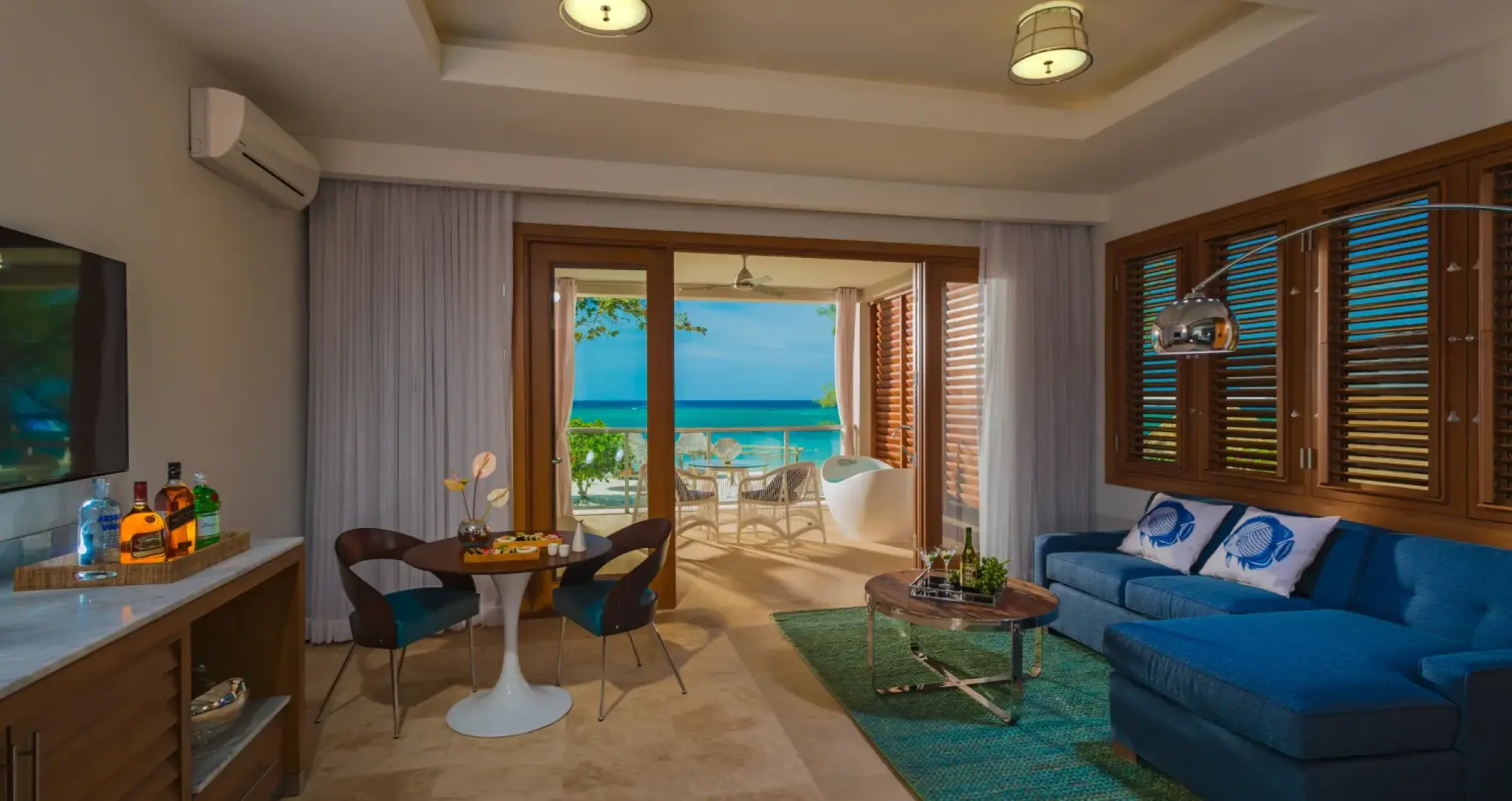 Master suite living area with ocean views at Sandals Montego Bay