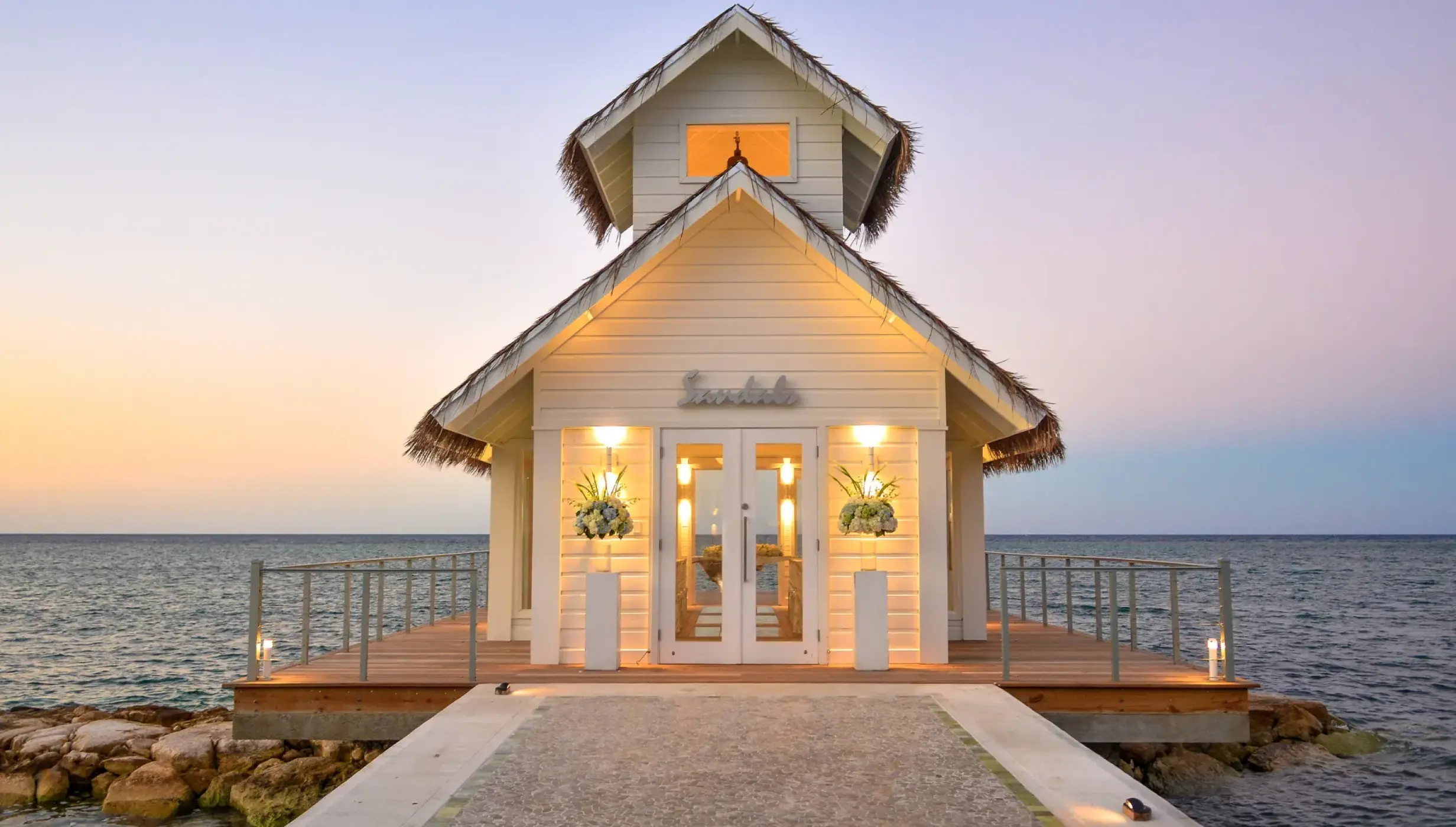 Overwater wedding chapel at Sandals Montego Bay at sunset, Montego Bay