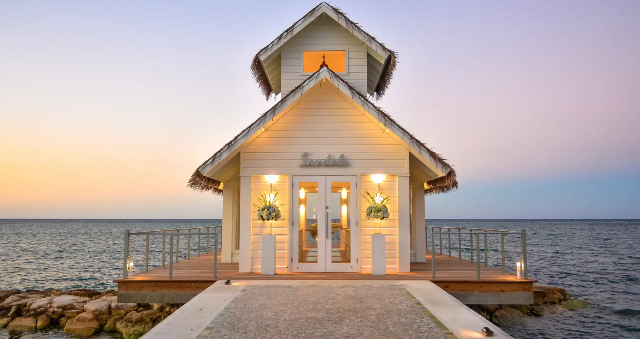 Overwater wedding chapel at Sandals Montego Bay at sunset, Montego Bay