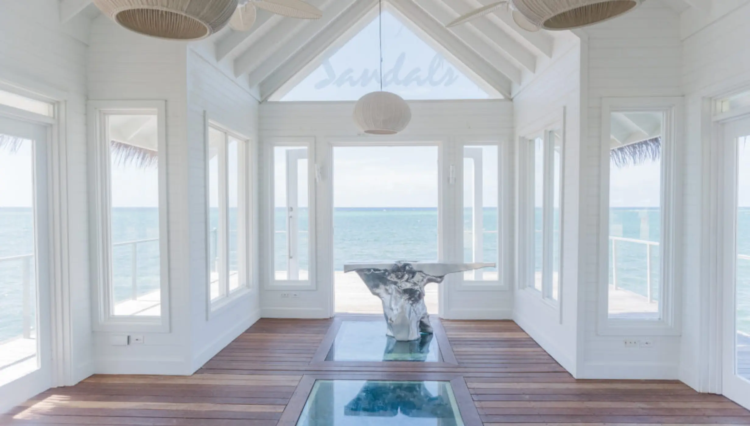 Overwater wedding chapel with glass floor panels at Sandals Montego Bay