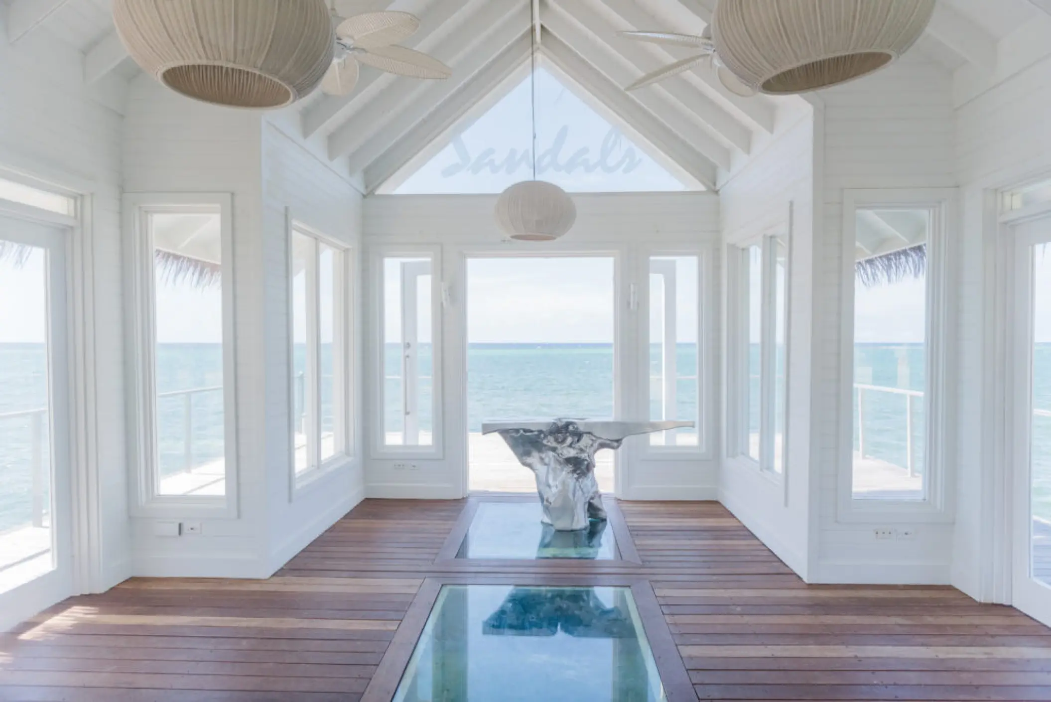 Overwater wedding chapel with glass floor panels at Sandals Montego Bay