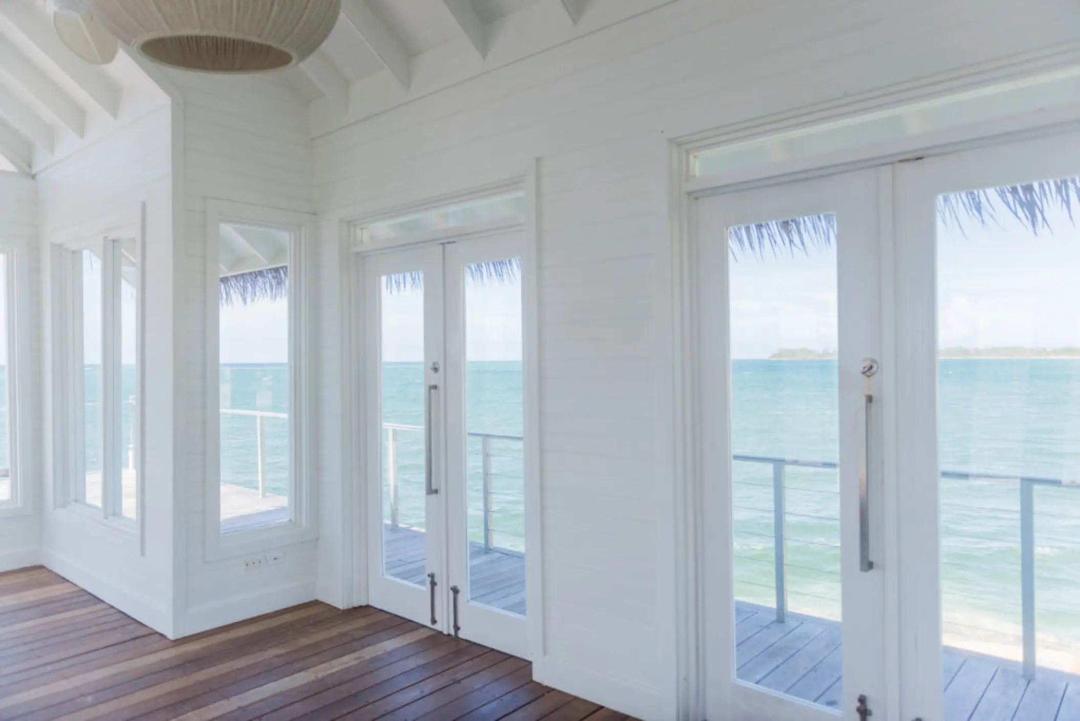 Interior of the white overwater wedding chapel at Sandals Montego Bay