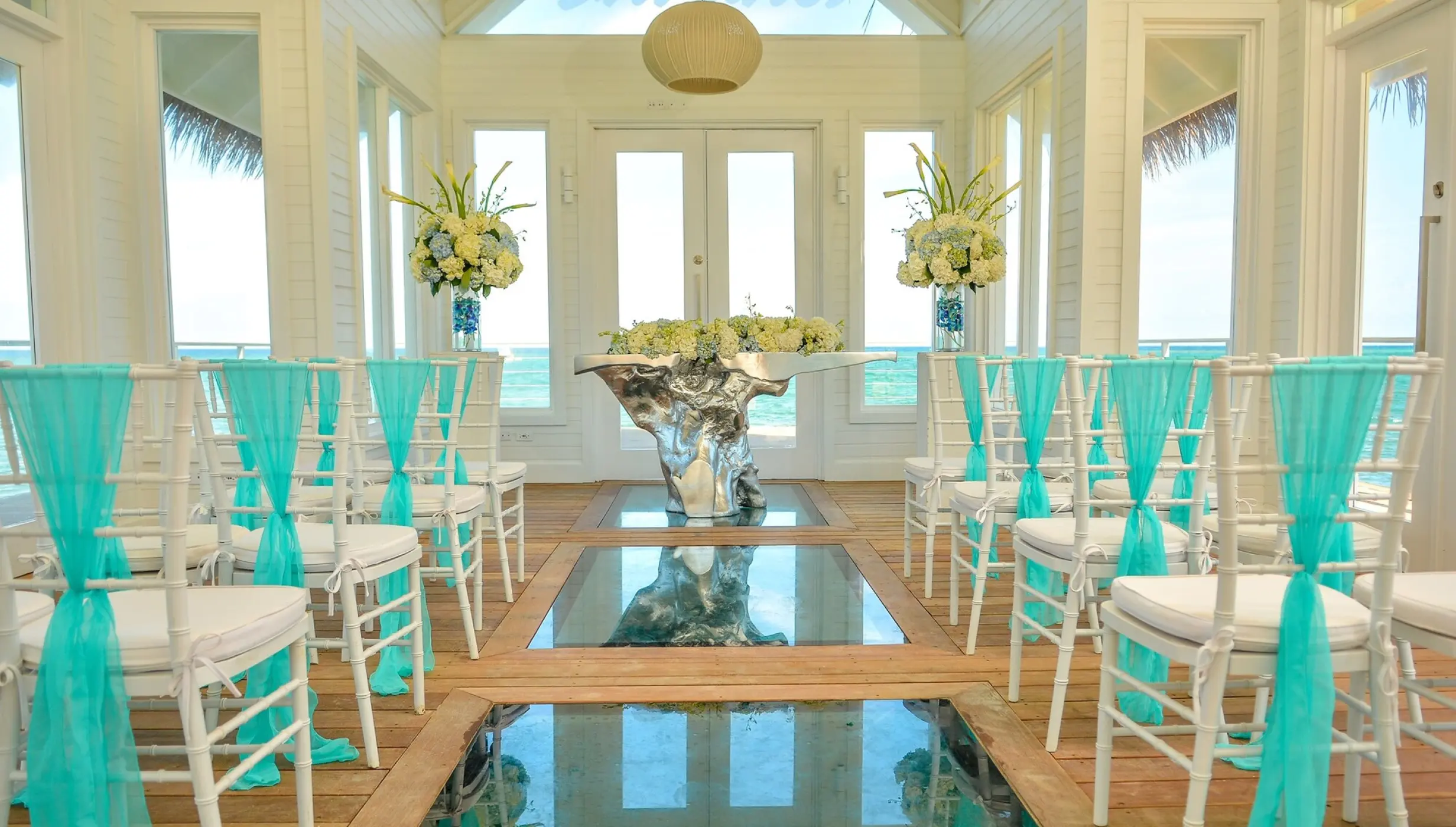 Overwater chapel wedding ceremony with glass floors at Sandals Montego Bay, Montego Bay