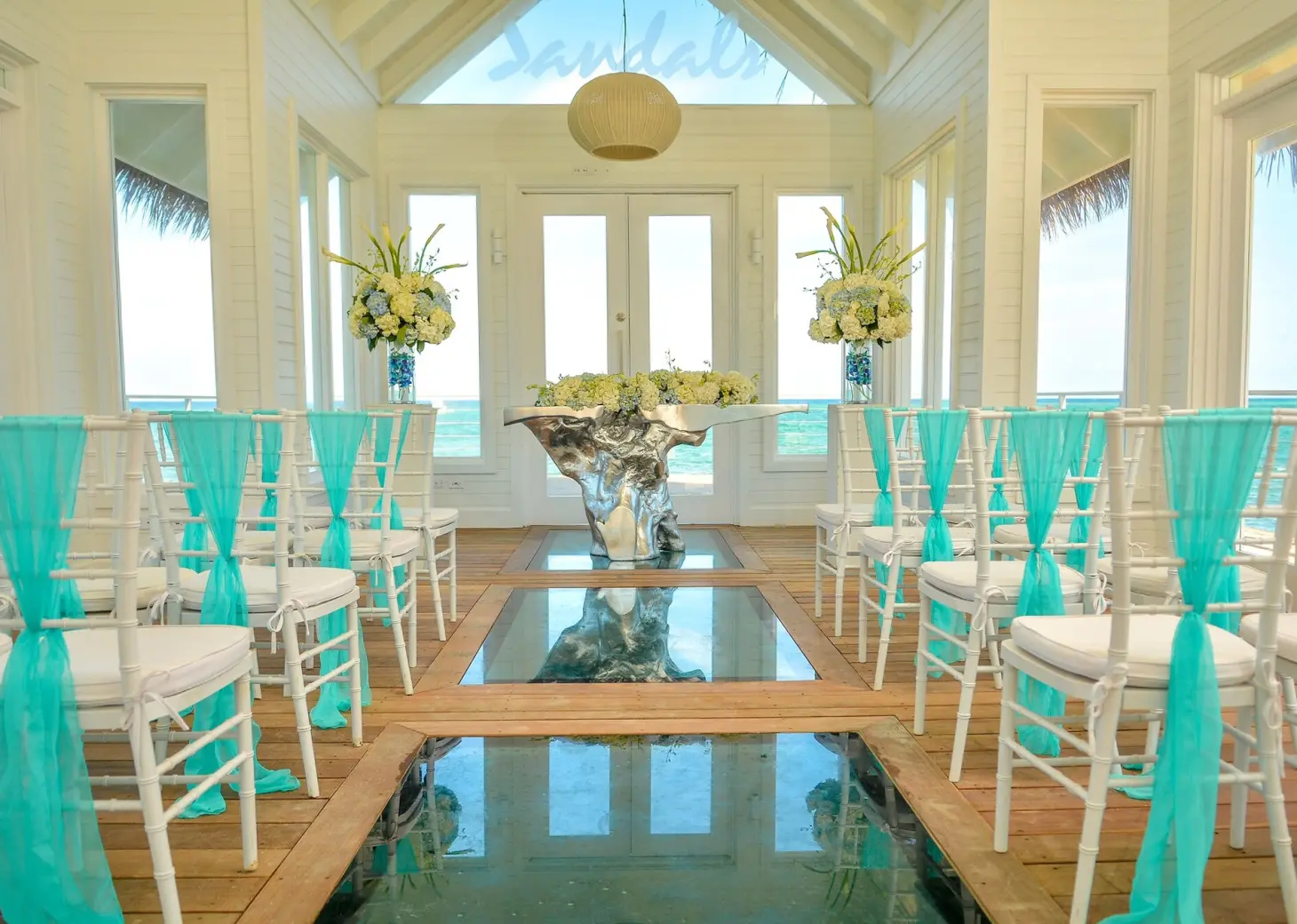 Overwater chapel wedding ceremony with glass floors at Sandals Montego Bay, Montego Bay