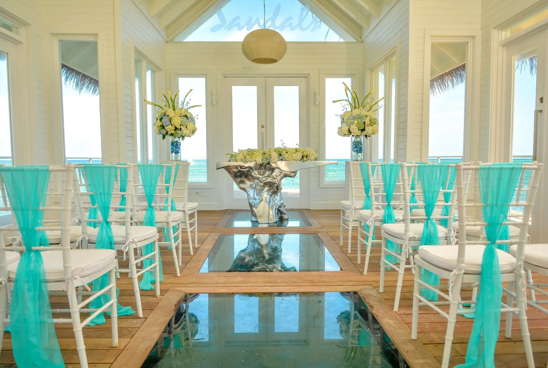 Overwater chapel wedding ceremony with glass floors at Sandals Montego Bay, Montego Bay