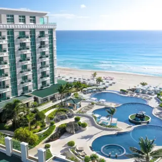Aerial view of Sandos Cancun tiered pools and beachfront, Cancun