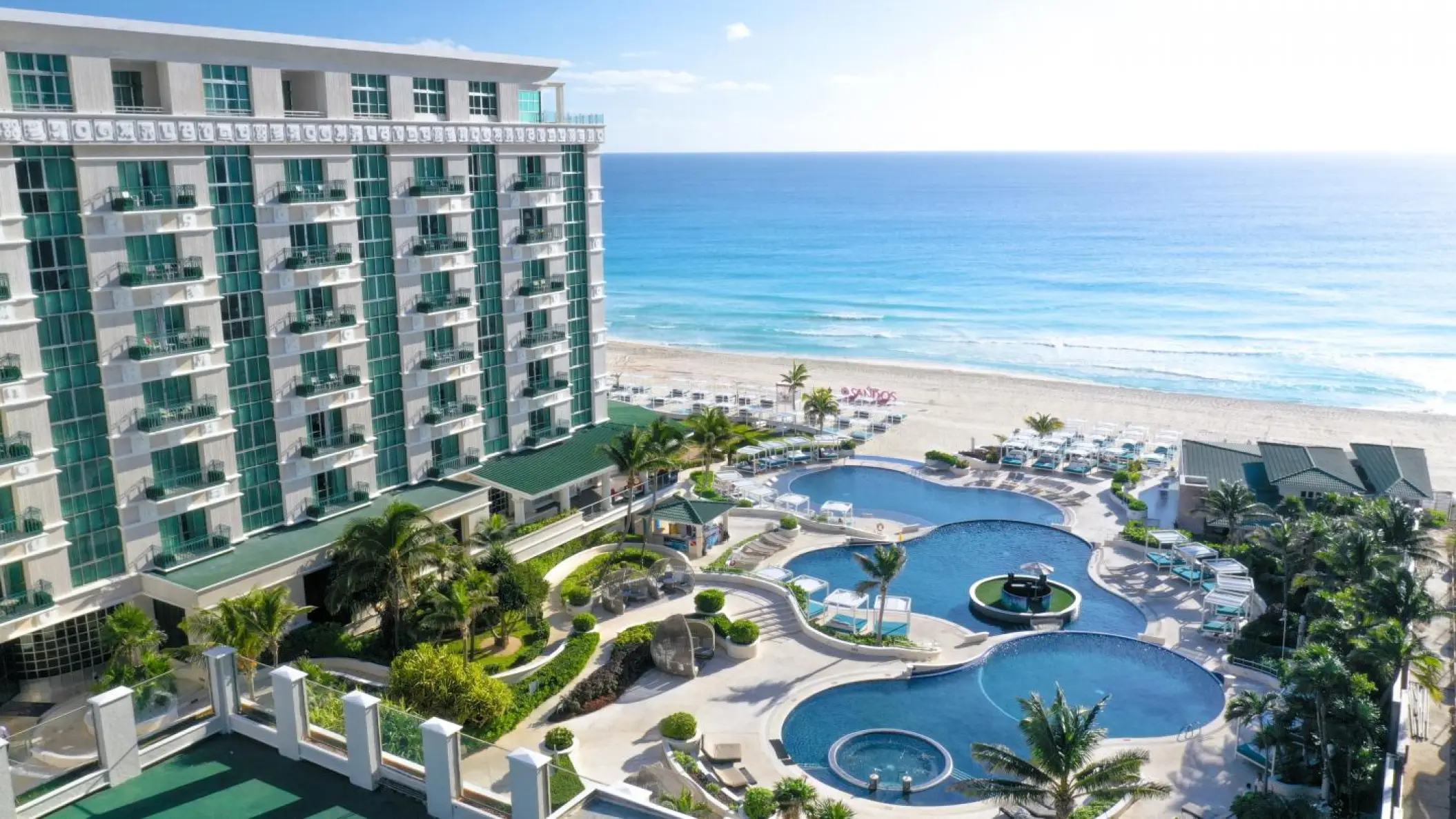 Aerial view of Sandos Cancun tiered pools and beachfront, Cancun