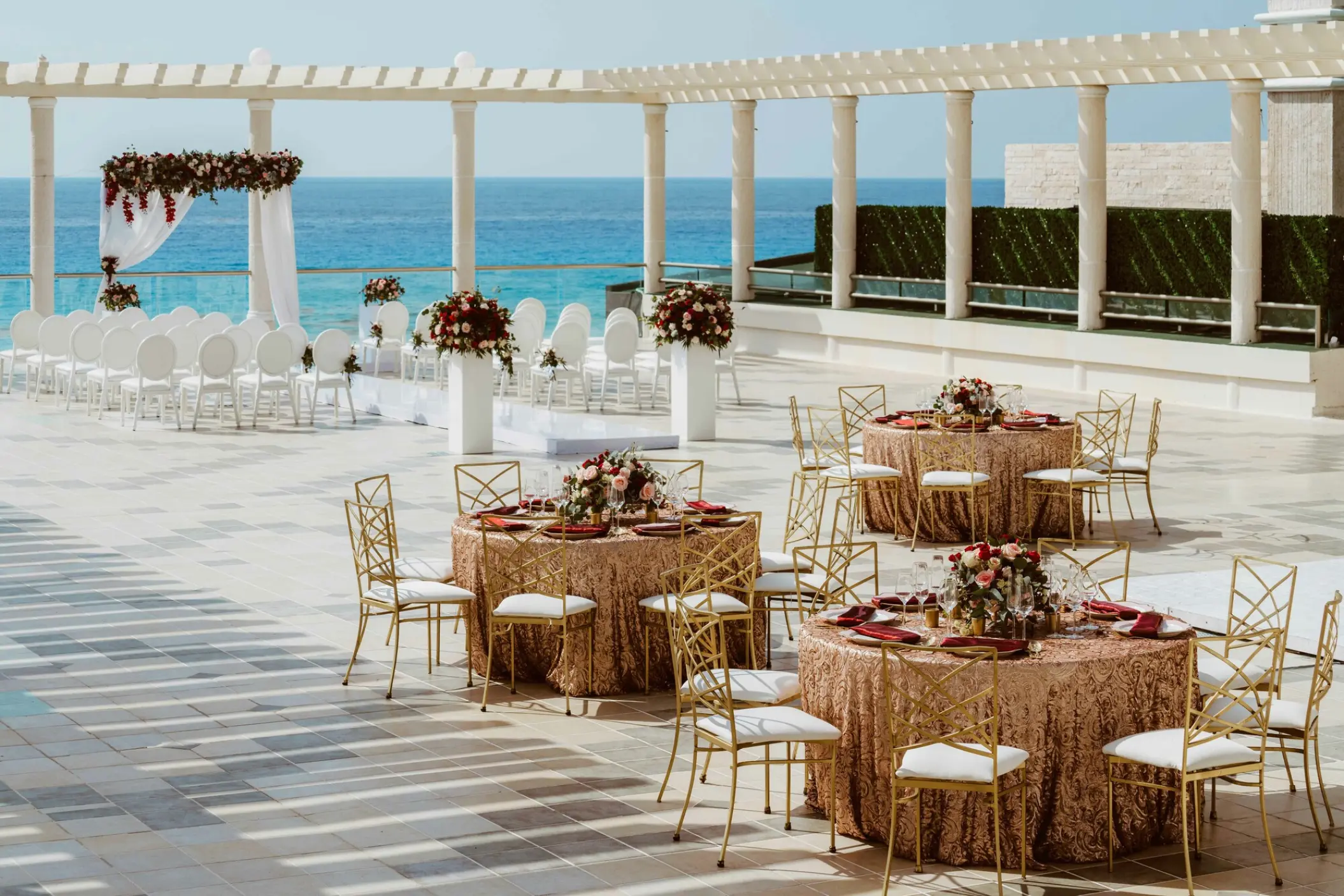 Rooftop wedding ceremony and reception setup overlooking the ocean at Sandos Cancun, Cancun