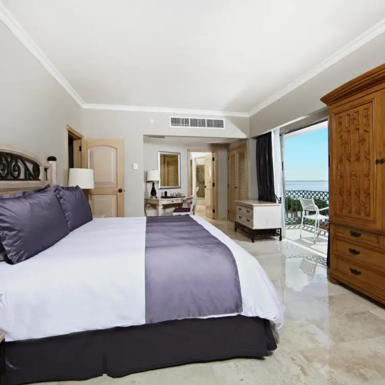 Modern guest suite with a private balcony at Sandos Cancun, Cancun