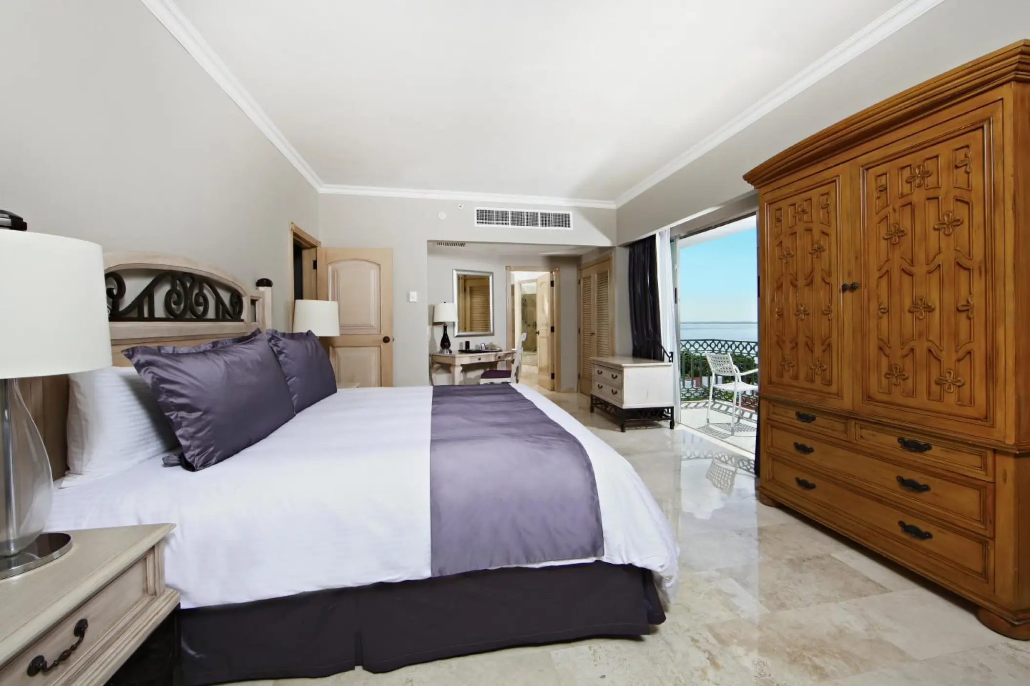 Modern guest suite with a private balcony at Sandos Cancun, Cancun