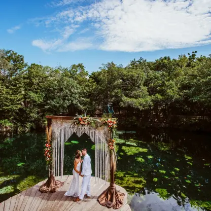 Cenote wedding ceremony with macrame arch at Sandos Caracol, Playa Del Carmen