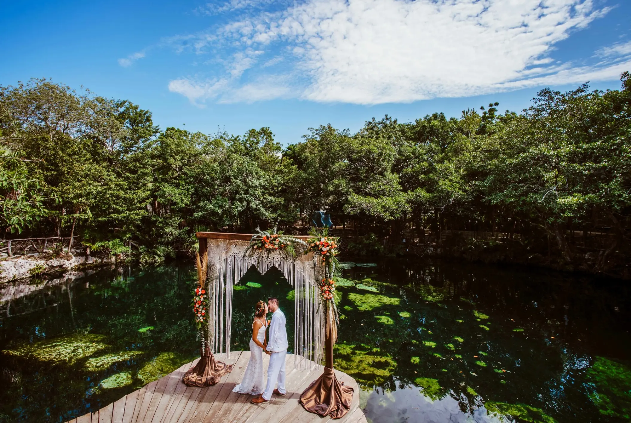 Cenote wedding ceremony with macrame arch at Sandos Caracol, Playa Del Carmen