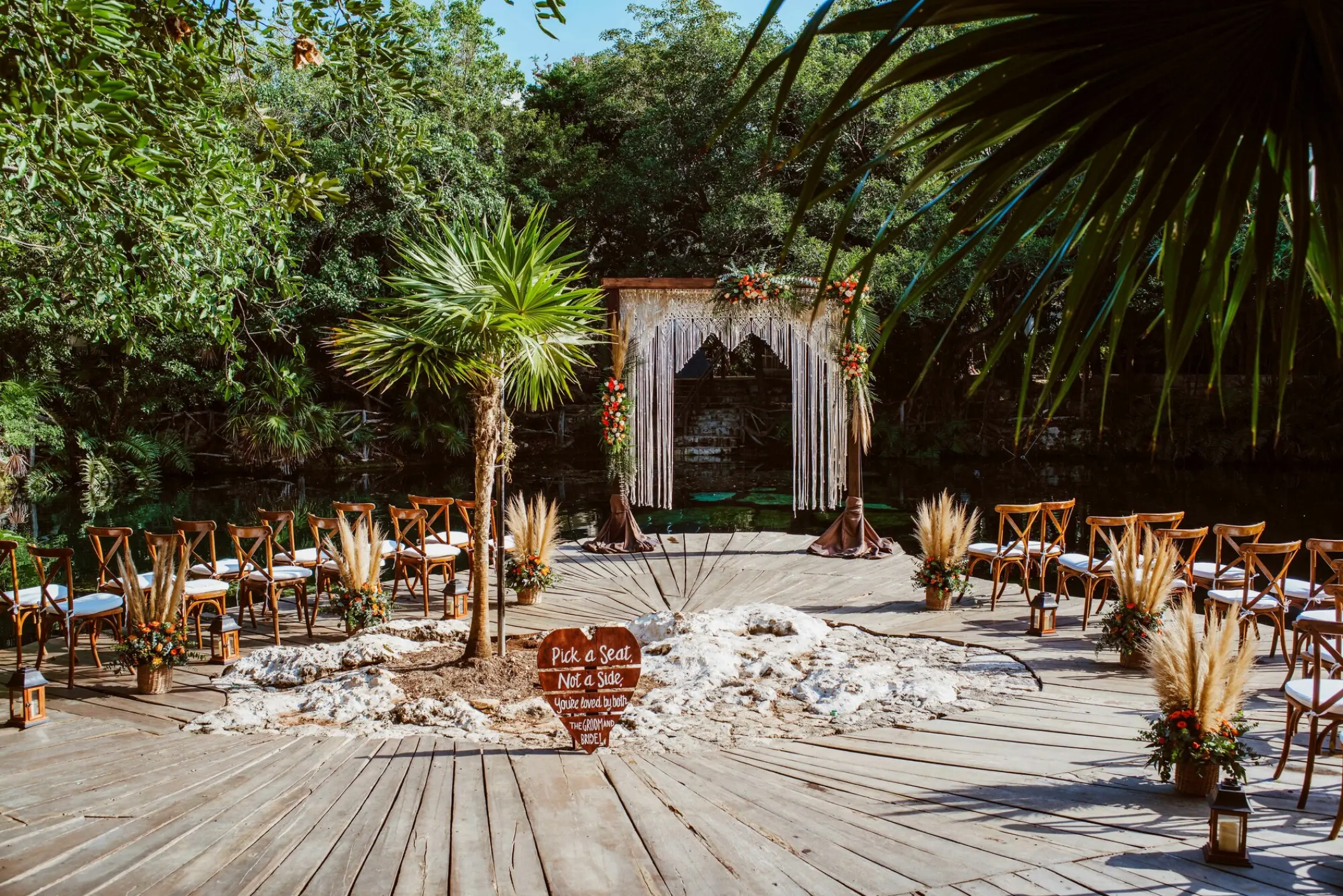 Cenote wedding ceremony setup with a wooden arch and macrame at Sandos Caracol, Playa Del Carmen