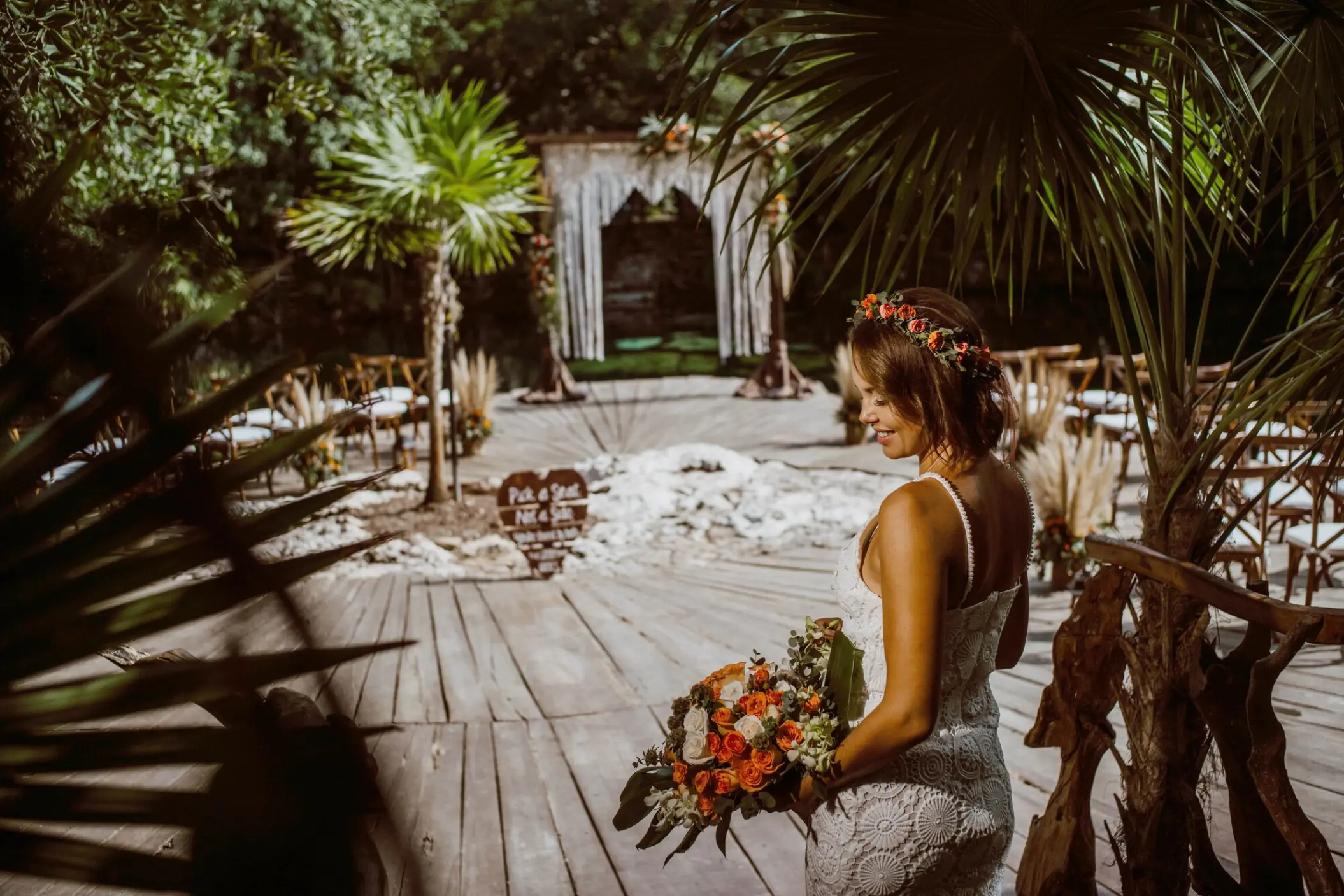Bride standing at the cenote wedding ceremony venue at Sandos Caracol Eco Resort, Playa Del Carmen