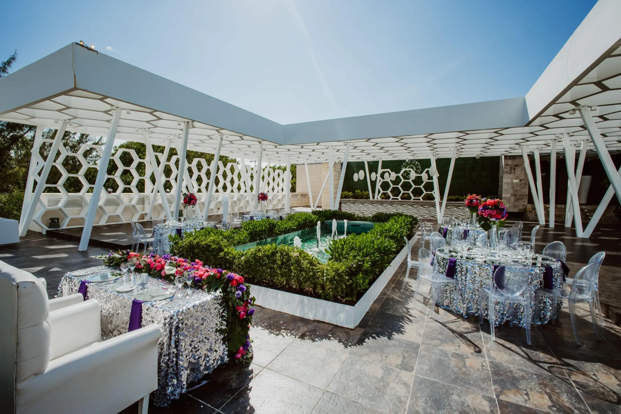 Rooftop terrace wedding reception with sequined linens at Sandos Caracol, Playa Del Carmen