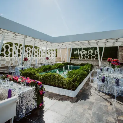 Rooftop terrace wedding reception with sequined linens at Sandos Caracol, Playa Del Carmen